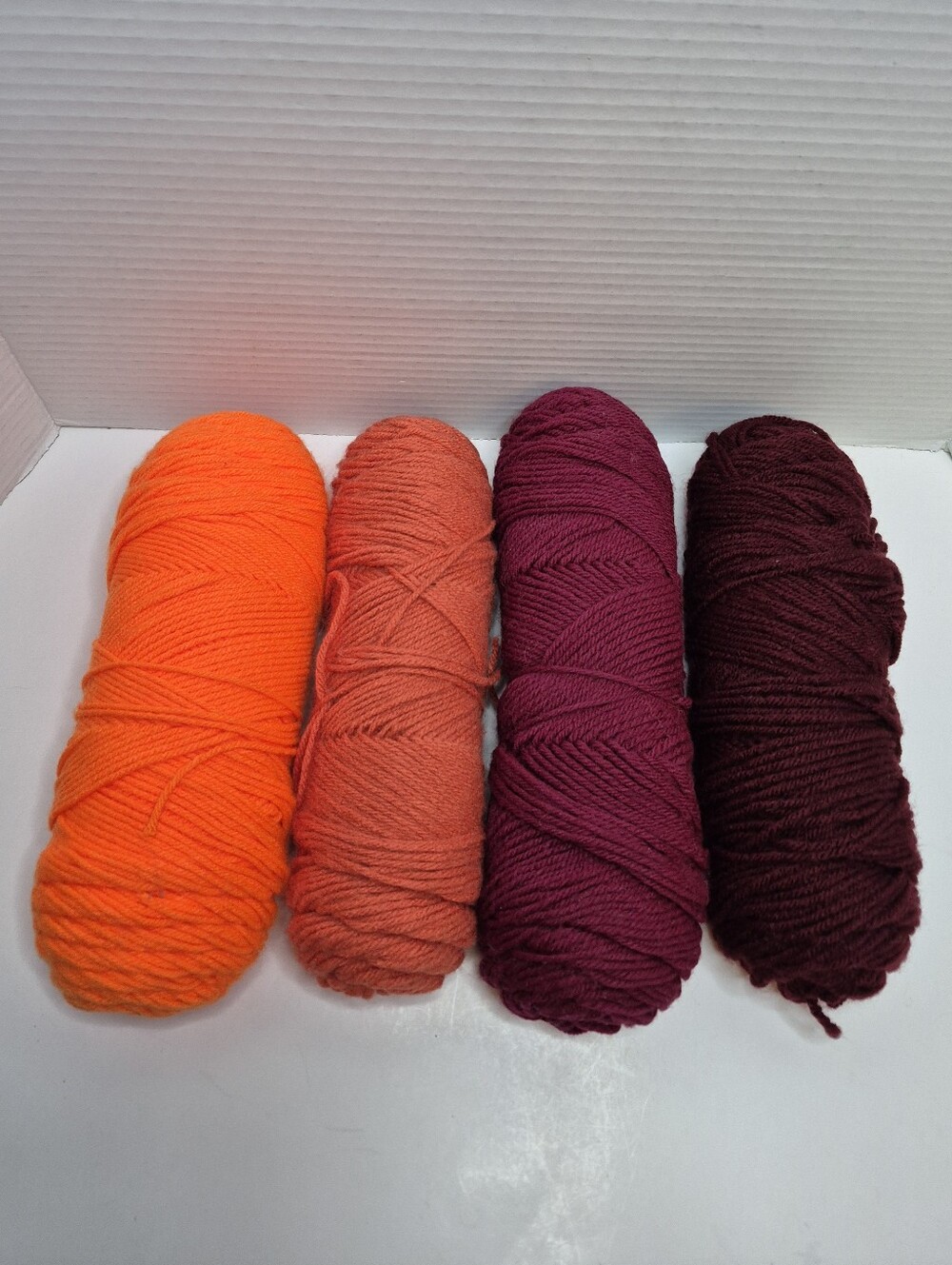 Colorful Bright Yarn Lot of Four Skeins Orange and Maroon Shades Shown